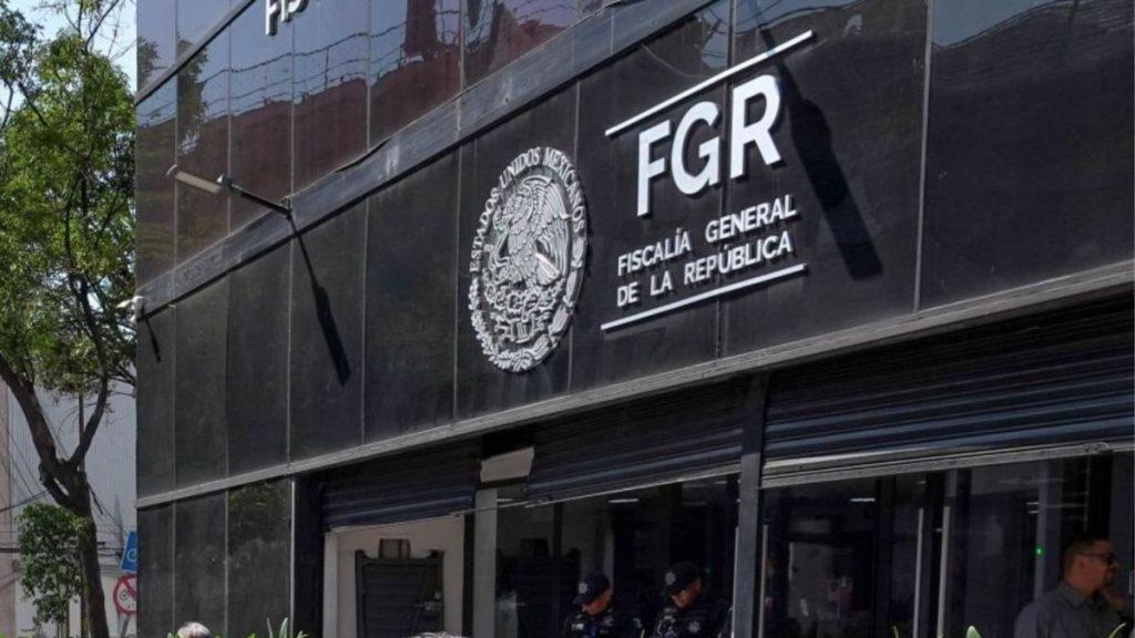 Facade of a Dark Glass Government Building with the Fgr Sign and Mexican Seal: Fiscalía General De La República - Enbroncados