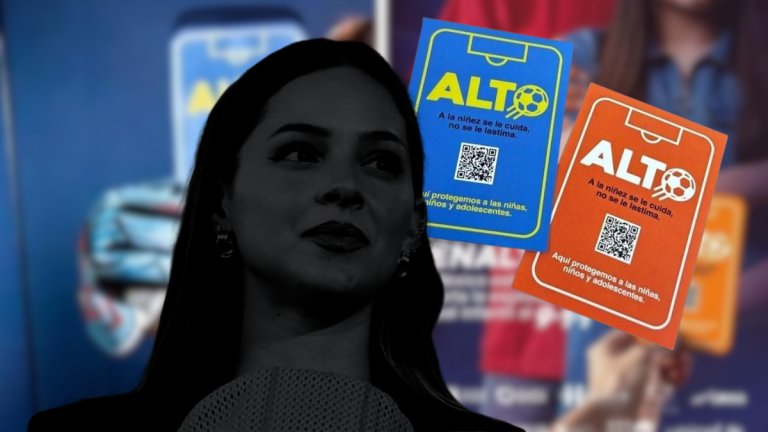 Silhouette of a Woman in the Foreground with Blue and Orange Alto Posters About Protecting Children in the Background. - Enbroncados