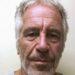 Close-up Portrait of an Older Man with Gray Hair and Light Stubble, Neutral Expression, Light Background. - Enbroncados