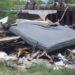 Pile of Trash and a Large Discarded Mattress Wedged Under a Bridge or Overpass. - Enbroncados