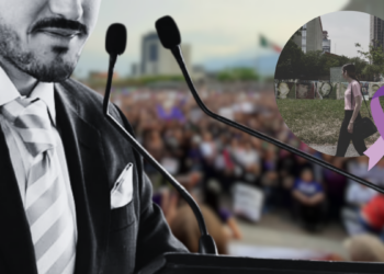 Public Speaker at a Podium Addressing a Crowded Outdoor Rally; a Purple Awareness Ribbon Overlays the Scene. - Enbroncados
