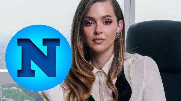 Portrait of a Woman in an Office Setting, with a Large Blue Circular Logo Featuring a Bold N over Her Left Side. - Enbroncados